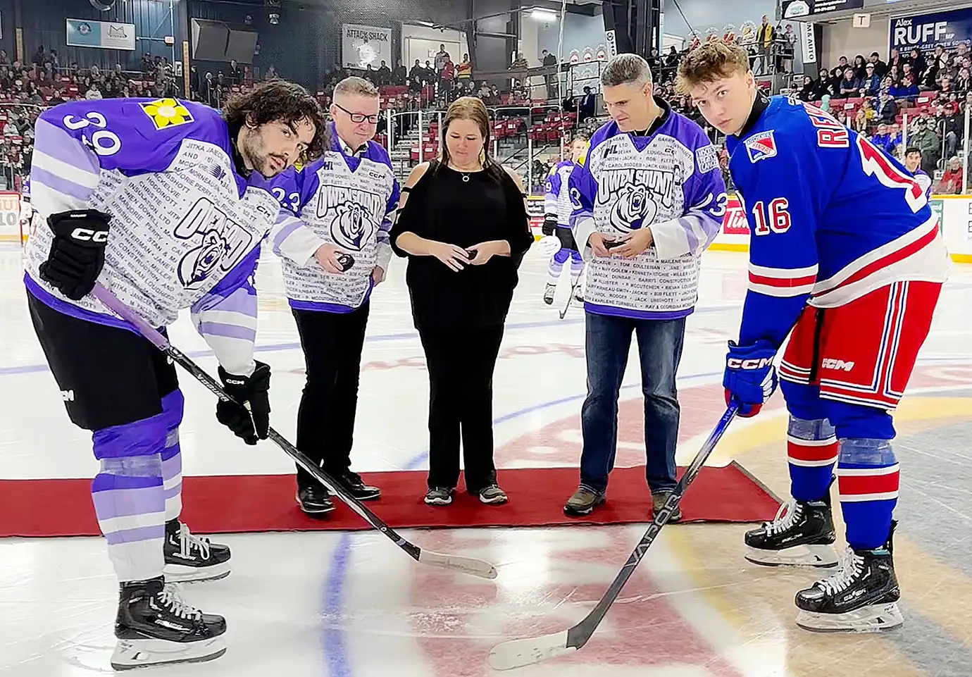 Photo of opening face off for Bruce Power supports Hockey Fights Cancer at Owen Sound Attack game